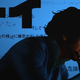 John Cho's Spike Spiegel lights a cigarette in an scene from the live-action Cowboy Bebop's opening titles.